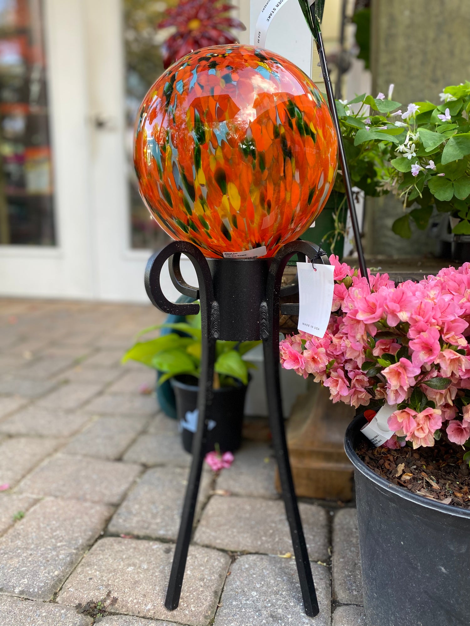 Fiery Orange Speckled Gazing Ball with Black Iron Stand